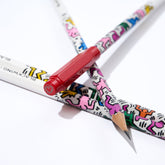 Blackwing Volume 292 Keith Haring pencils - one with a red point guard featuring Haring's "Radiant Heart" illustration